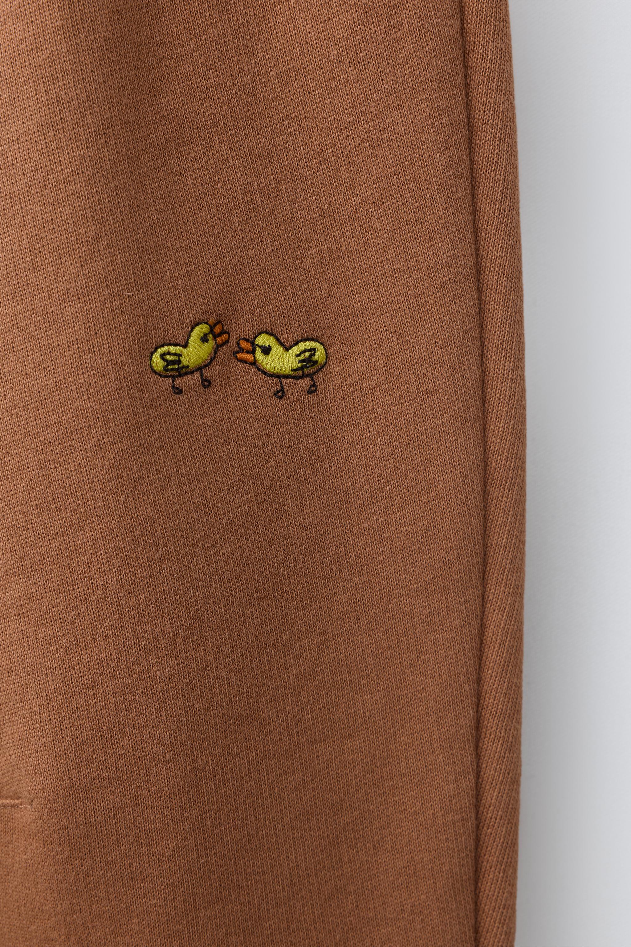 EMBROIDERED ANIMAL PLUSH PANTS